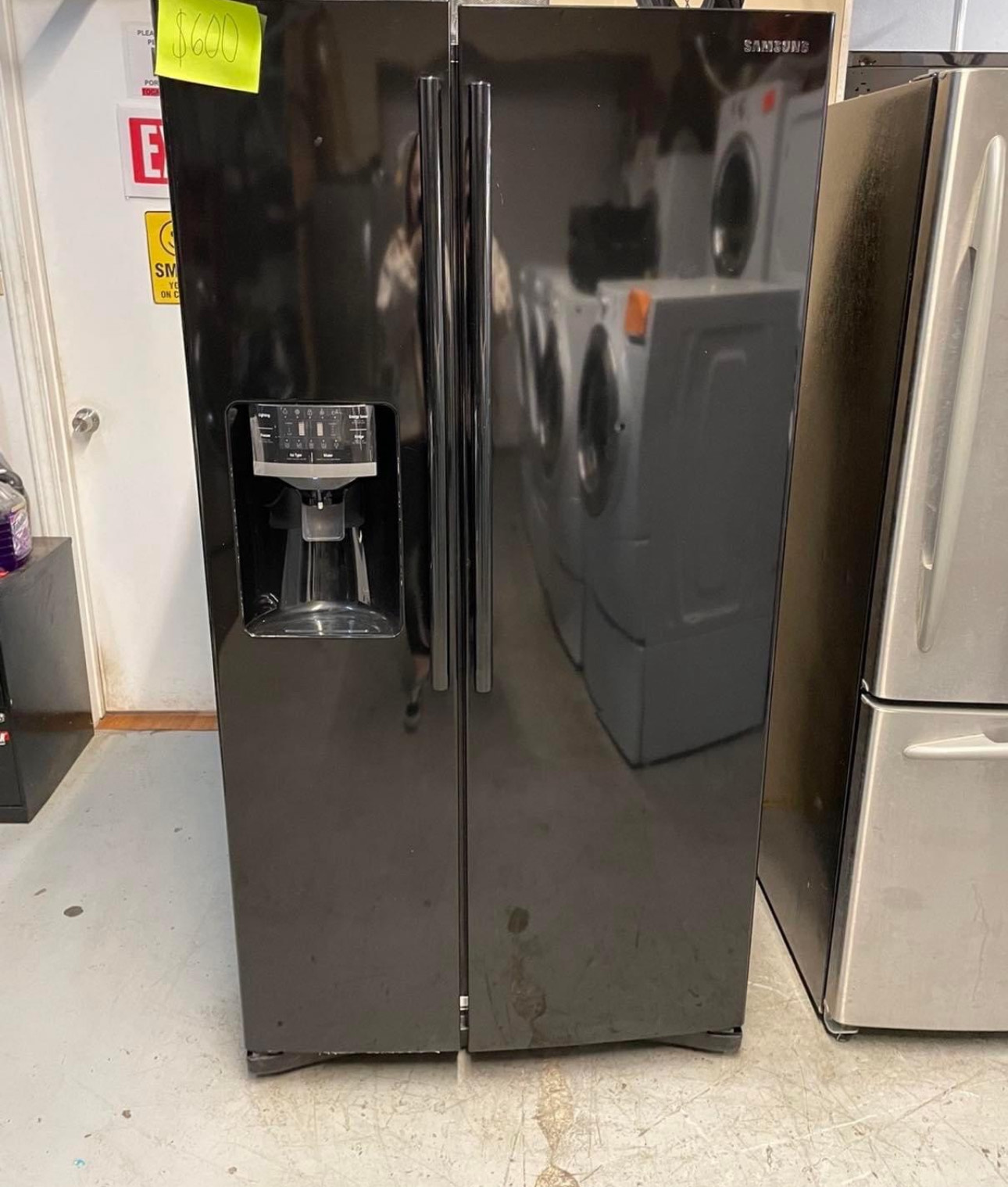 24.5 cu. ft. side by side refrigerator with a black finish, featuring twin cooling plus system