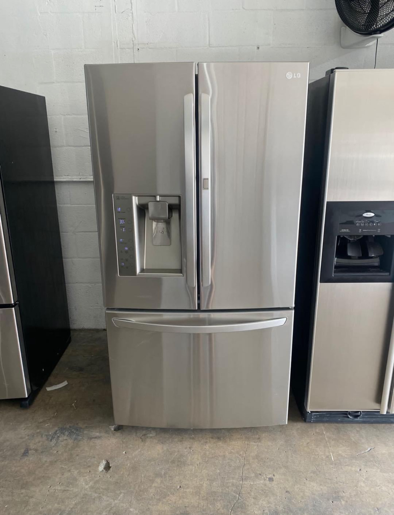 lg 30.5 cu. ft. french door refrigerator with a door in door feature and a 3 tier freezer.
