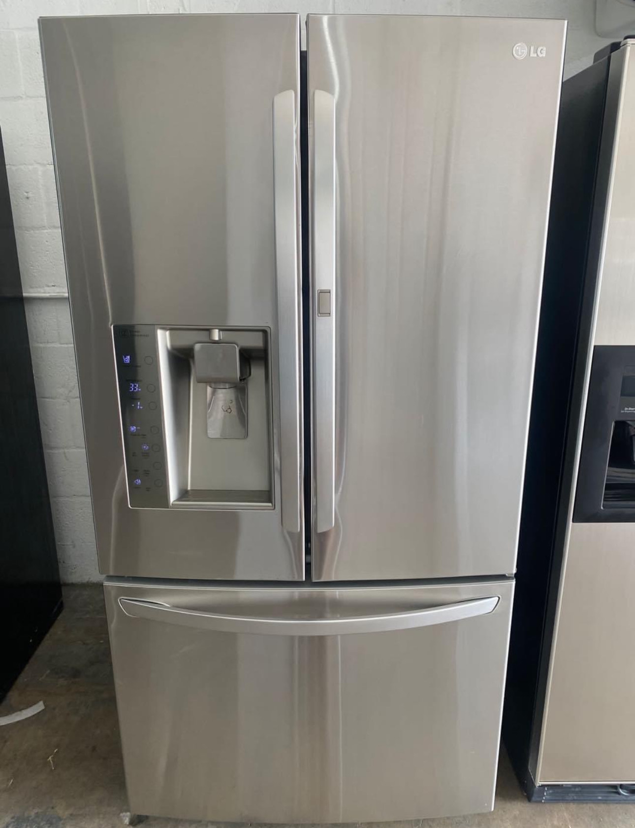 lg 30.5 cu. ft. french door refrigerator with a door in door feature and a 3 tier freezer.