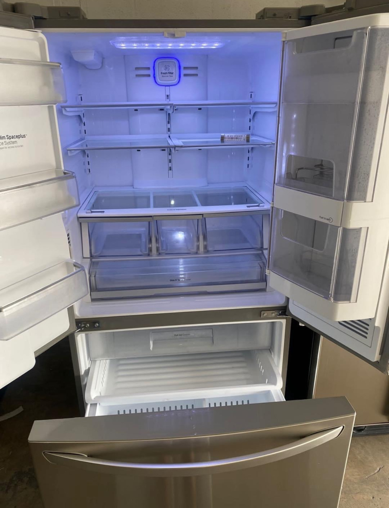 lg 30.5 cu. ft. french door refrigerator with a door in door feature and a 3 tier freezer.