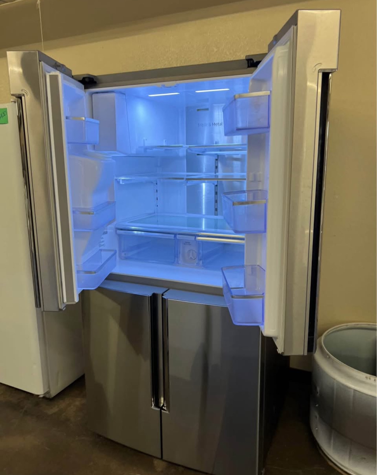 samsung 36 inch, 4 door french door refrigerator known for its 27.9 cu. ft. capacity and the family hub™ connected touchscreen with bixby voice assistant