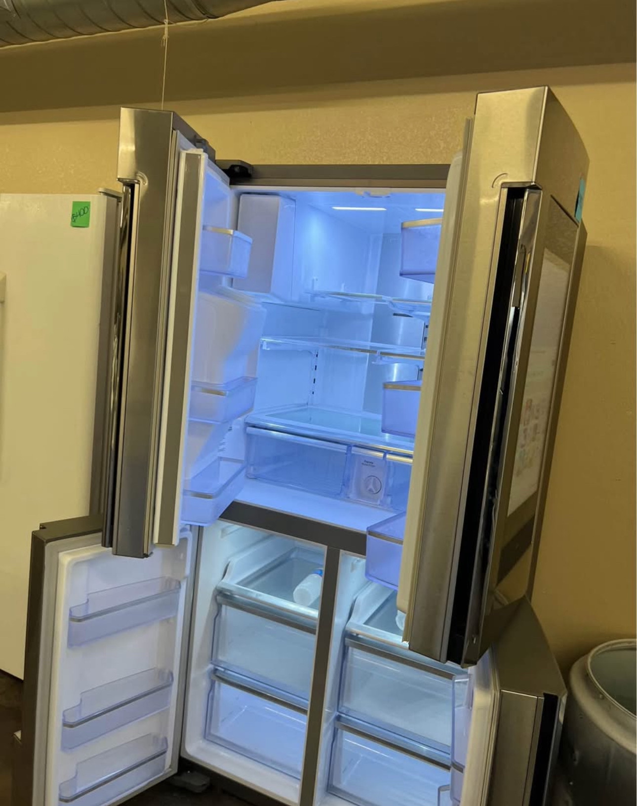 samsung 36 inch, 4 door french door refrigerator known for its 27.9 cu. ft. capacity and the family hub™ connected touchscreen with bixby voice assistant