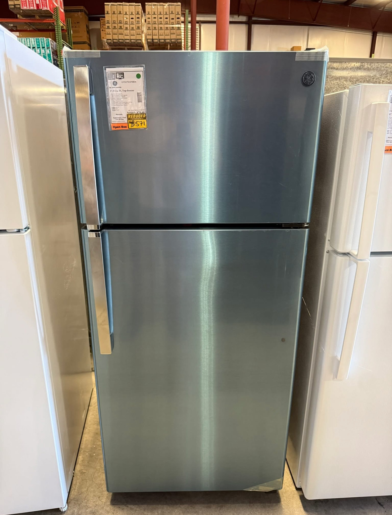 ge 16.6 cubic foot top freezer refrigerator with a width of 28 inches, a height of 64.75 inches, and a depth of 32.63 inches