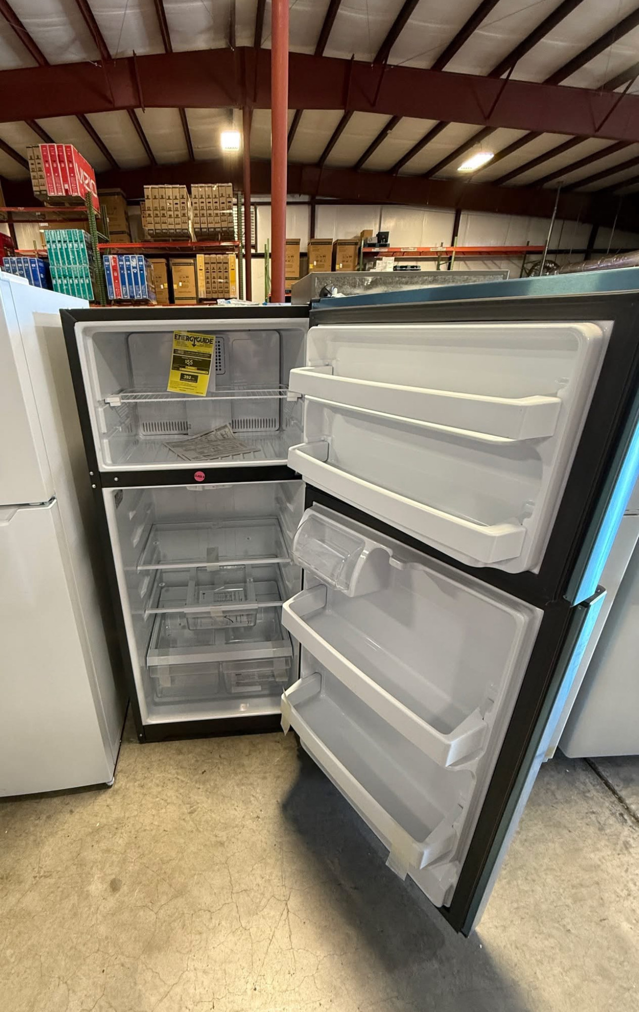 ge 16.6 cubic foot top freezer refrigerator with a width of 28 inches, a height of 64.75 inches, and a depth of 32.63 inches