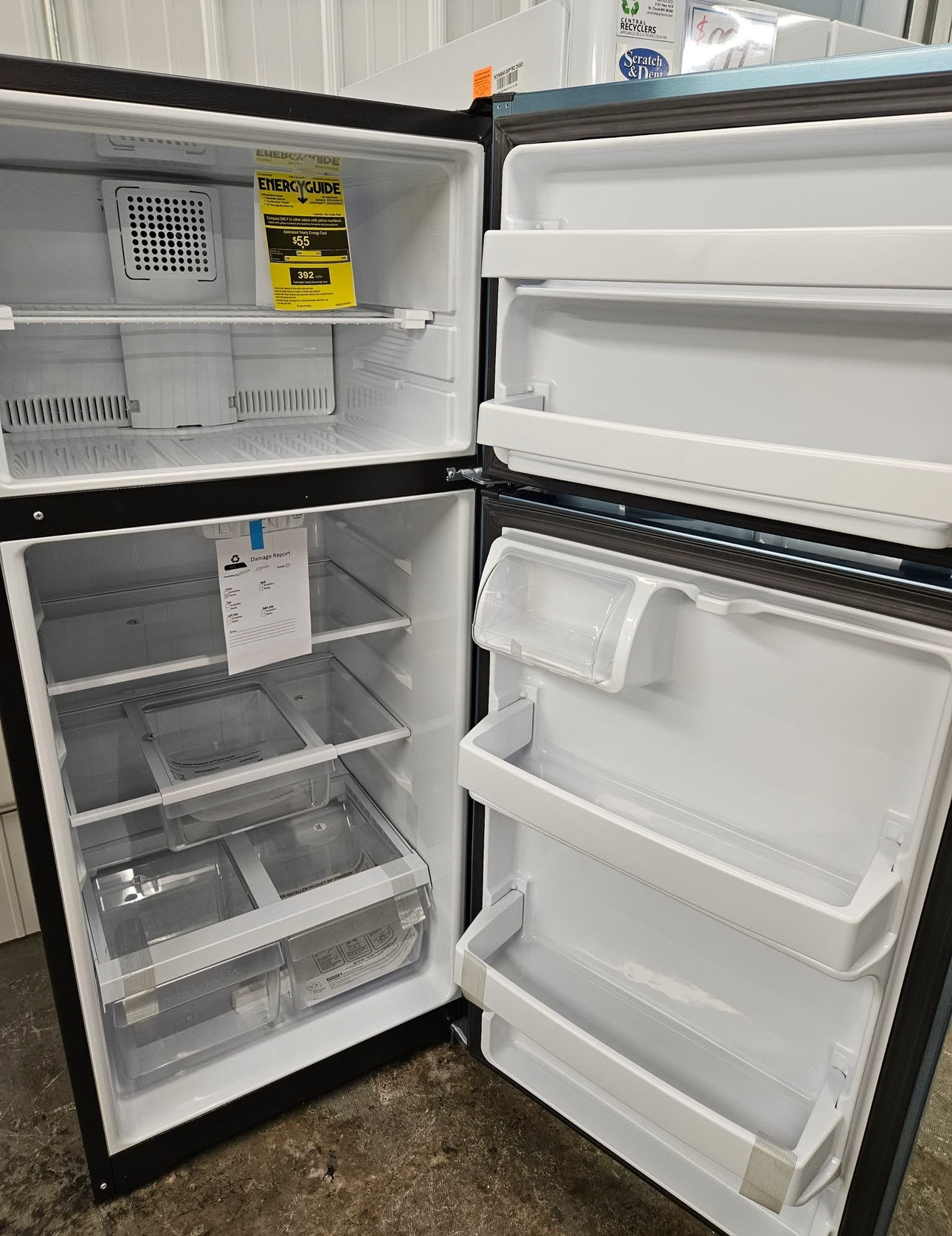 ge 16.6 cubic foot top freezer refrigerator with a width of 28 inches, a height of 64.75 inches, and a depth of 32.63 inches