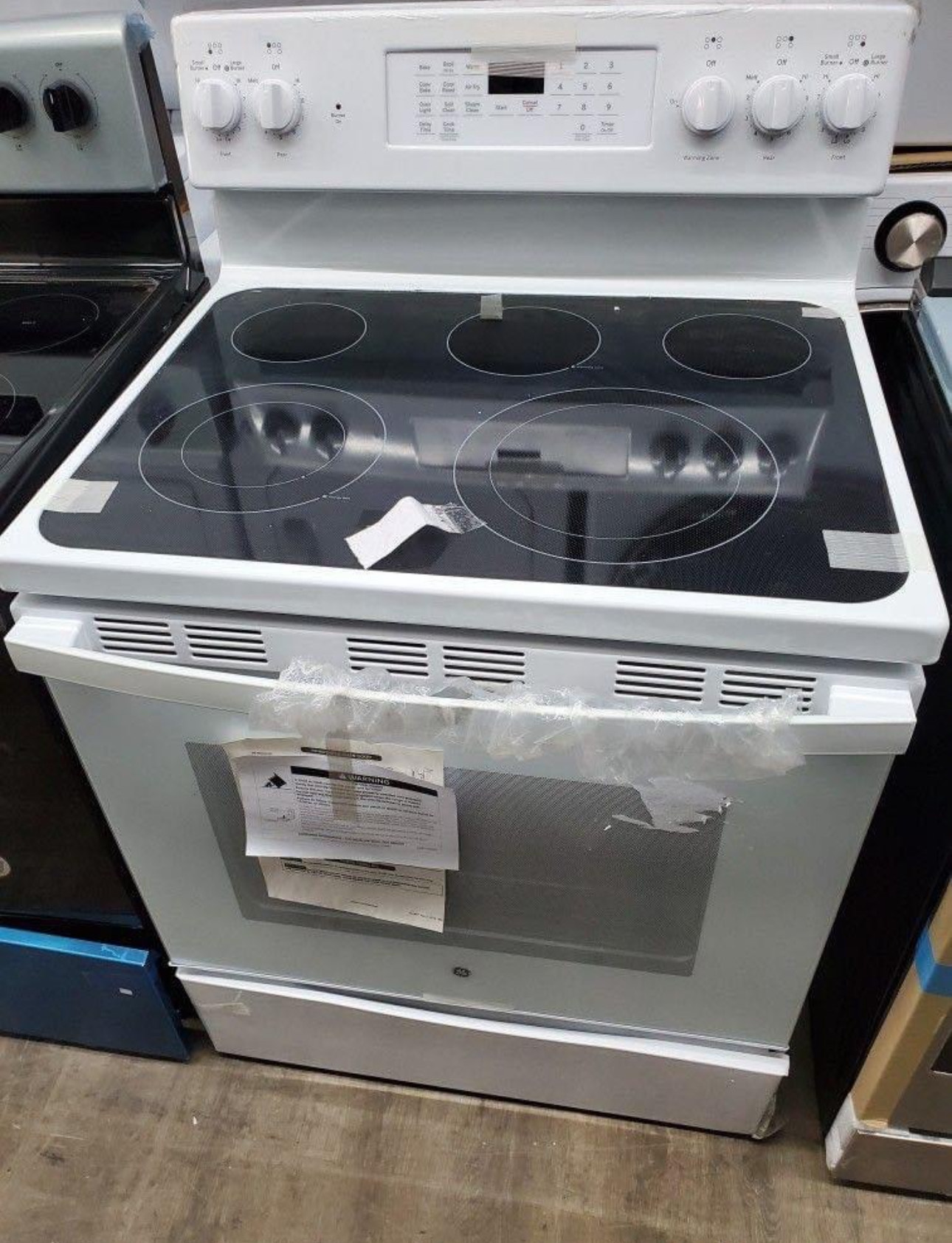 ge 30 inch free standing electric range with a 5.3 cubic foot capacity oven and a radiant smoothtop cooktop