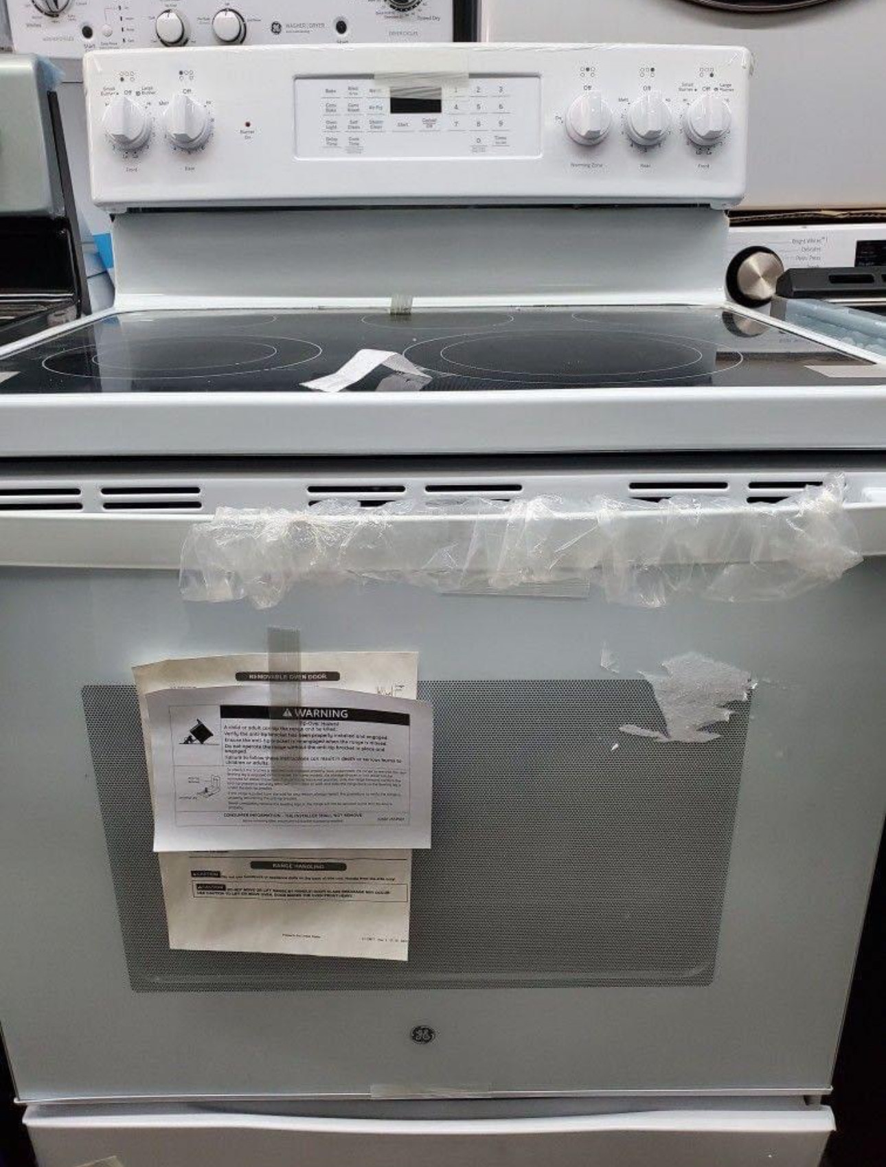 ge 30 inch free standing electric range with a 5.3 cubic foot capacity oven and a radiant smoothtop cooktop